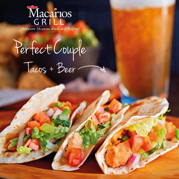 Three Macarios Grill tacos filled with meat, lettuce, and tomatoes, next to a glass of beer.